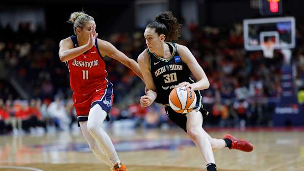 New York Liberty forward Breanna Stewart dribbles past Washington Mystics forward Elena Delle Donne.